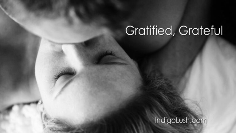 Gratified, Grateful - a woman is kissed in a black and white image