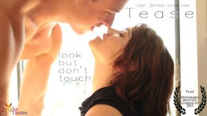 Tease - a man looms over a woman almost kissing her. "Look but don't touch"